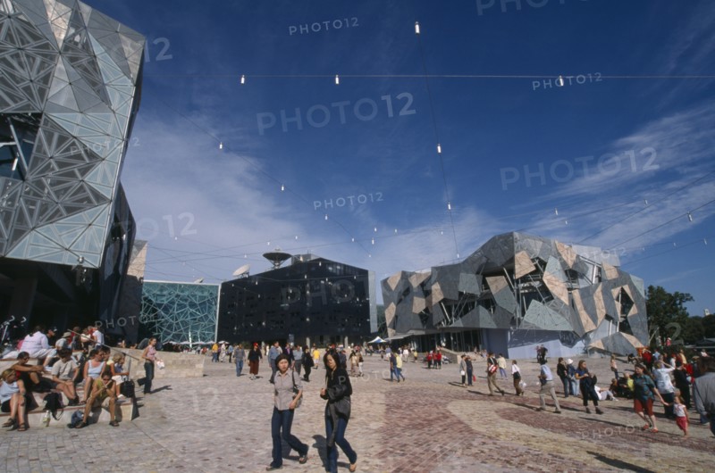 AUSTRALIA, Victoria, Melbourne, "Federation Square.  Public civic centre and meeting place, modern architecture and crowds of people."