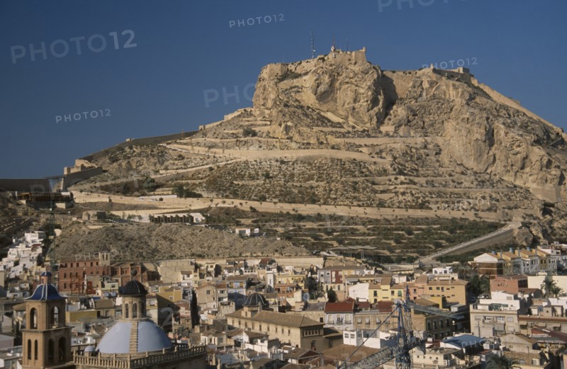 SPAIN, Pais Valenciano, Costa Blanca, "Alicante.  Castle on top of steep, rocky hillside with city spread out below."