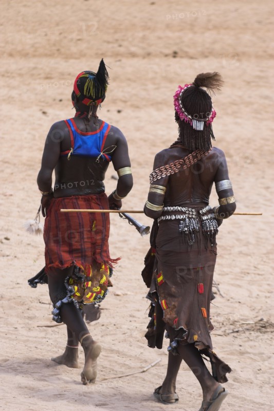 ETHIOPIA, Lower Omo Valley, Turmi, "Hamer Jumping of the Bulls initiation ceremony, Women sing and dance before the bull jumping Jane Sweeney "