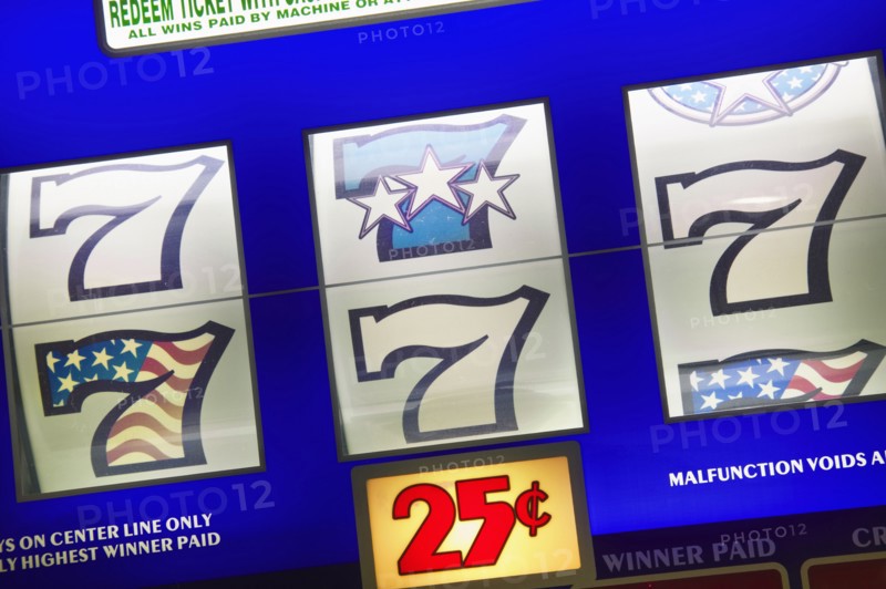 20091068 Detail slot machine dials showing lucky number seven 25 cents play. Gambling  Casino 7 American North America United States America  Region - North AmericaLeisure ActivitiesDominant Blue Jon Hicks 20091068 USA Nevada Las Vegas