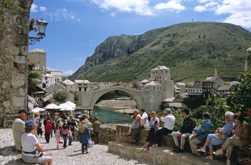 BOSNIA HERZEGOVINA, Mostar, "Stari Most, Old Bridge, following reconstruction, tourists, and Neretva River. Former Yugoslavia"