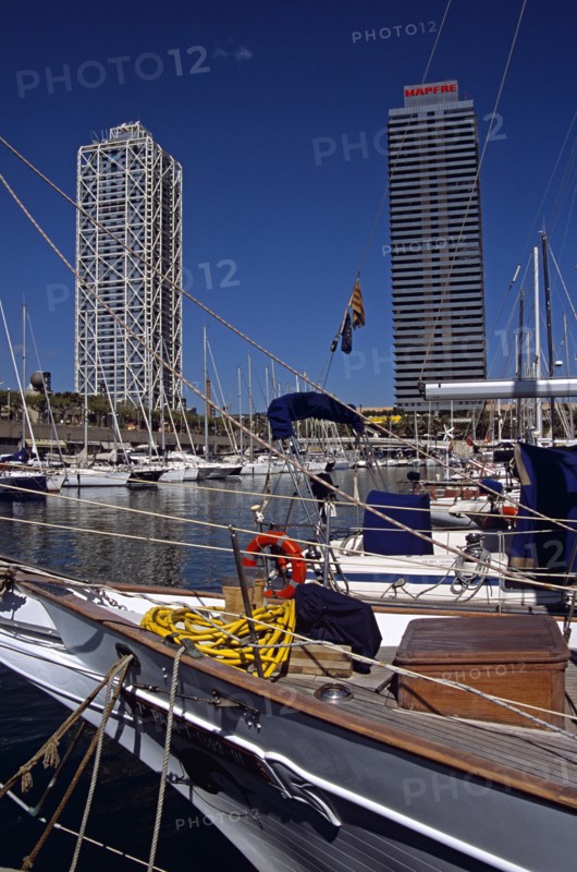 SPAIN, Catalonia, Barcelona, "Port Olimpic, Bow of yacht, marina, Hotel Arts and Torre Mapfre"