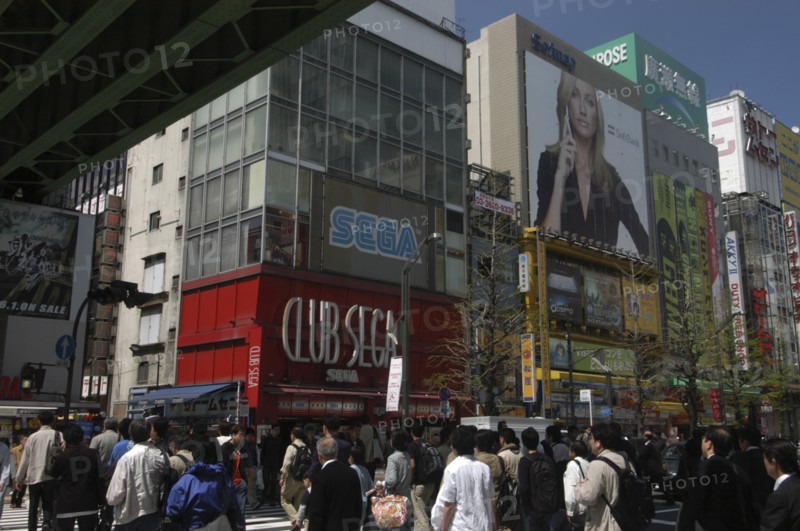 JAPAN, Honshu, Tokyo, "Akihabara - huge billboard of Cameron Diaz advertising SoftBank cell phones, shoppers crossing Chuo-dori"