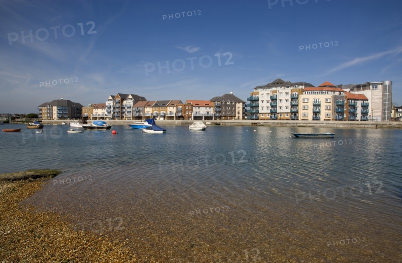 ENGLAND, West Sussex, Shoreham-by-Sea, Ropetackle modern housing development apartments on the banks of the river Adur seen from the opposite bank.. A regenerated brownfield former industrial area.