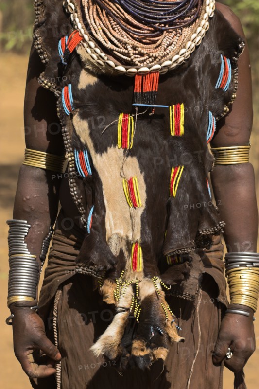 ETHIOPIA, Omo Valley, Mago National Park, Womans necklaces and traditional goatskin dress decorated with cowrie shells  Jane Sweeney