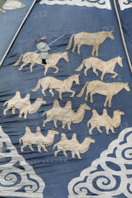 MONGOLIA, Ulan Bator, "Detail of ancient silk tapestry depicting man on horseback herding camels and horses, in Ulan Bator Museum.. Ulaanbaatar East Asia Asian Baator Equestrian Male Men Guy Mongol Uls Mongolian Ulaan  "