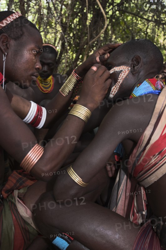 ETHIOPIA, Lower Omo Valley, Turmi, "Hama Jumping of the Bulls initiation ceremony, Face painting with a mixture of clay, oils and plant pigment"