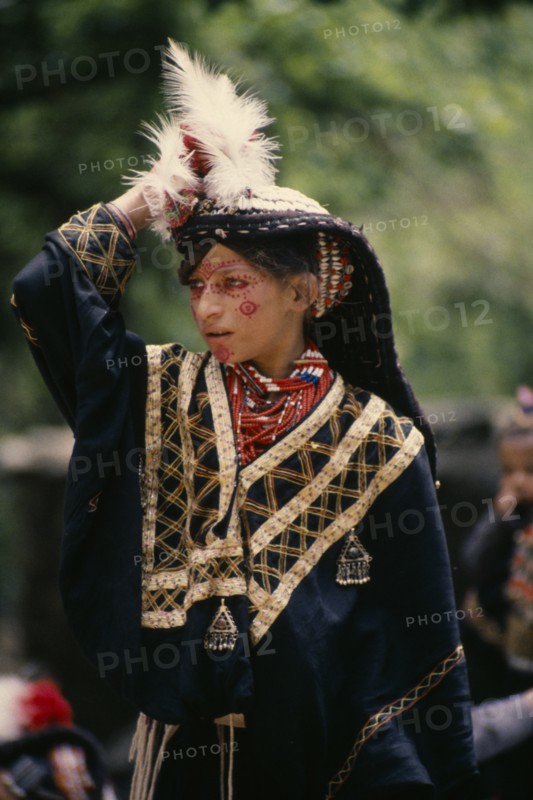PAKISTAN, North West Frontier, Bumburet, Young Kalash girl wearing traditional dress at the Chilimjusht Festival in Bumburet