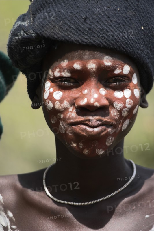 ETHIOPIA, South Omo Valley, Mursi Tribe, Boy with face painting