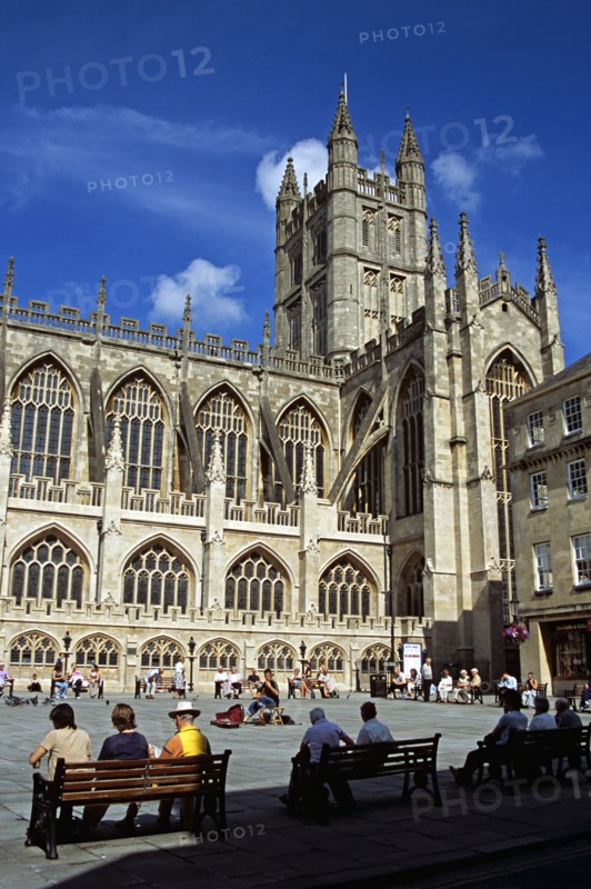 ENGLAND, Somerset, Bath, "Bath Abbey, classical guitarist and tourists, Bath, Somerset, England "