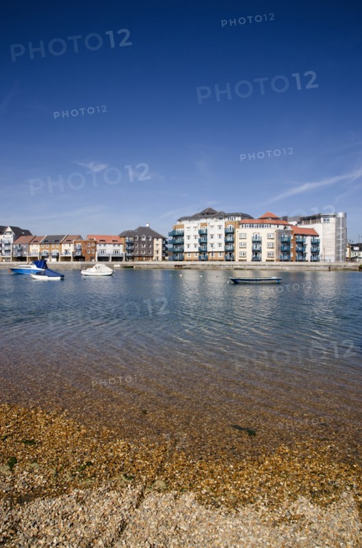 ENGLAND, West Sussex, Shoreham-by-Sea, Ropetackle modern housing development apartments on the banks of the river Adur seen from the opposite bank.. A regenerated brownfield former industrial area.