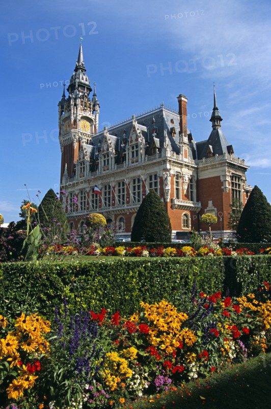FRANCE, Nord Picardy, Pas-de-Calais, "Calais, colourful flowers and Town Hall."