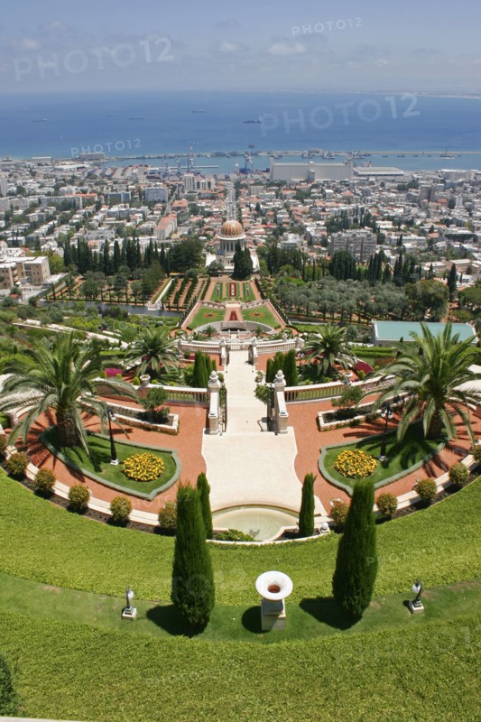 ISRAEL, Northern Coast, Haifa, "Zionism Avenue.  View of Baha'i Shrine and Gardens designed as a memorial to the founder of the Baha’i faith.  Tiered gardens and pathways with palms and cypress trees, central domed shrine and city beyond."
