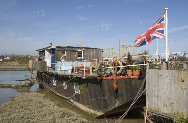 ENGLAND, West Sussex, Shoreham-by-Sea, Houseboats moored along the banks of the river adur.