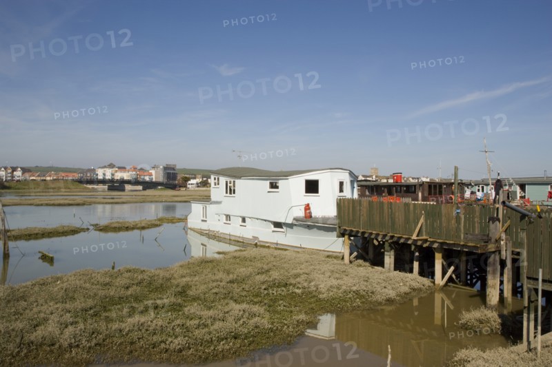 ENGLAND, West Sussex, Shoreham-by-Sea, Houseboats moored along the banks of the river adur.