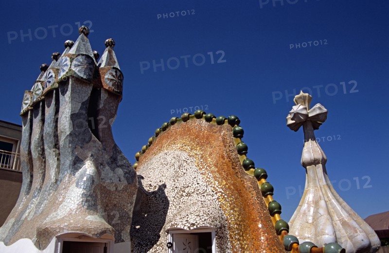 SPAIN, Catalonia, Barcelona, "Passeig de Gracia, Casa Batllo, Ornate chimneys, Dragon's back roof and Saint George cross. Gaudi"