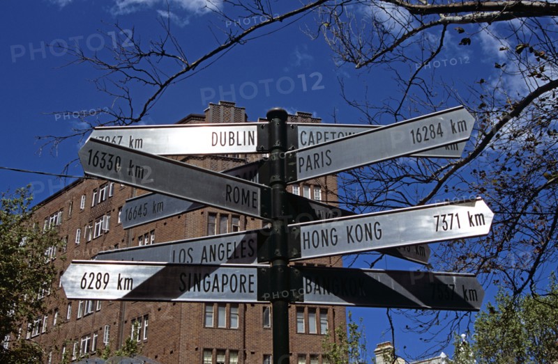 AUSTRALIA, New South Wales, Sydney, "Country and city destination distance sign beside El Alamein Fountain, near Kings Cross."
