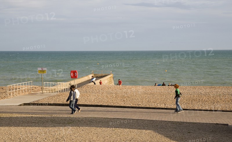ENGLAND, East Sussex, Brighton, Rollerblading on the seafront promenade.
