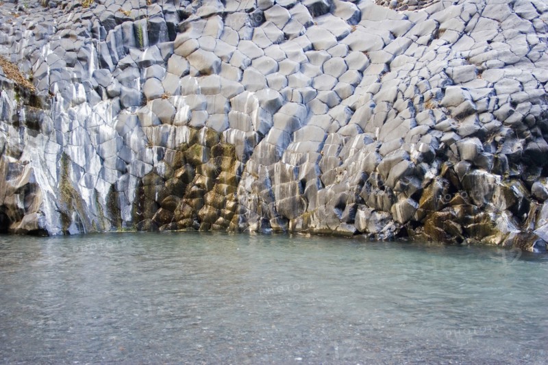 ITALY, Sicily, Alcantara, Alcantara Fluvial Park.  Volcanic rocks in a fish scales formation.