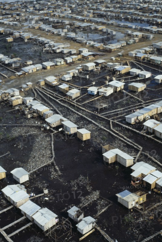 ECUADOR, Guayas Province, Guayaquil , Aerial view over slum housing with stilt buildings built over untreated sewage