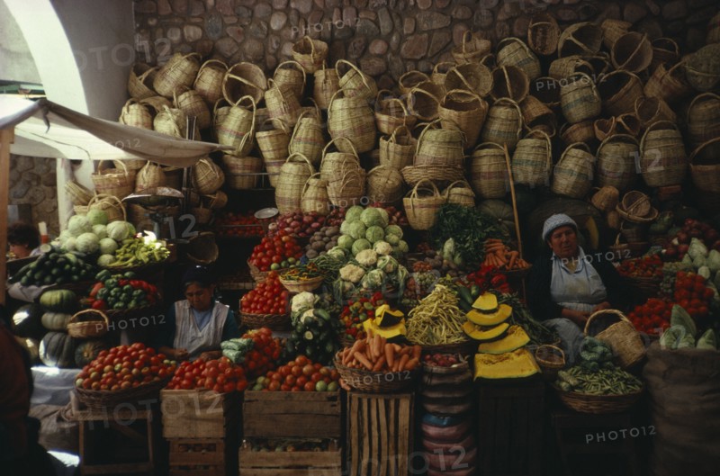 BOLIVIA, Sucre, "Market stall selling fruit , vegetables and locally made baskets"