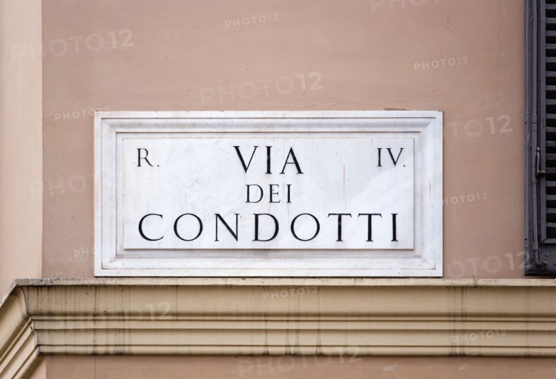 ITALY, Lazio, Rome, Marble street sign on a wall for Via Dei Condotti the high fashion shopping street