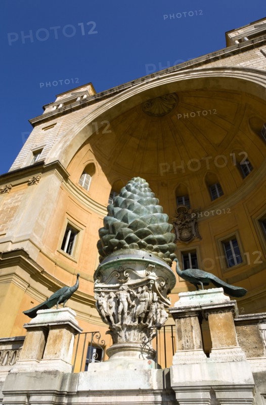 ITALY, Lazio, Rome, Vatican City Museums The Cortille della Pigna a huge bronze pine cone from a Roman fountain in a niche below the Papal heraldic crest in a niche by Pirro Ligorio on the Belvedere Palace