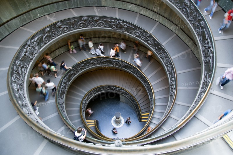 ITALY, Lazio, Rome, Vatican City Museums Tourists descending the Spiral Ramp designed by Giuseppe Momo in 1932 leading from the museums to the street level below