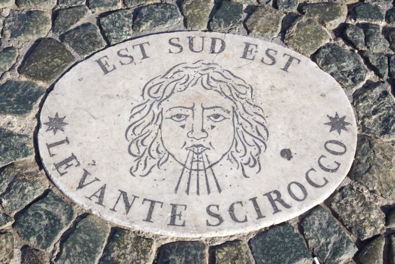 ITALY, Lazio, Rome, Vatican City Plaque in the pavement of Piazza San Pietro or St Peter's Square depicting the East South East wind know as the Levante Scirocco