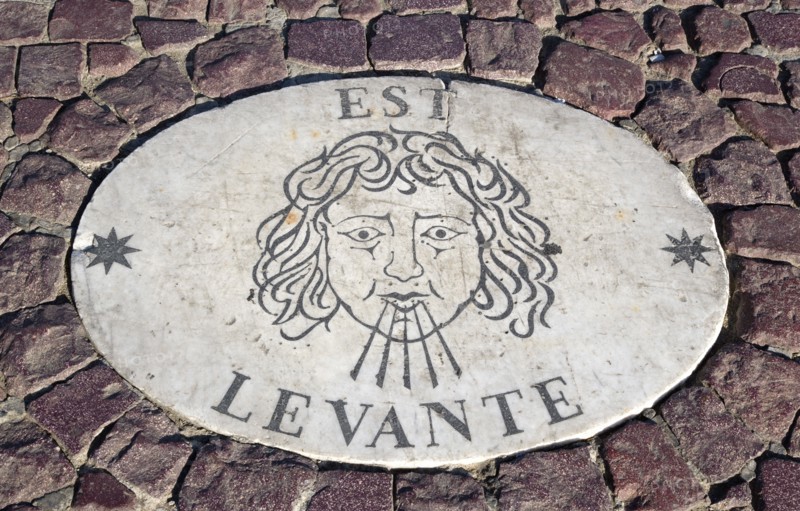 ITALY, Lazio, Rome, Vatican City Plaque in the pavement of Piazza San Pietro or St Peter's Square depicting the East wind know as the Levante