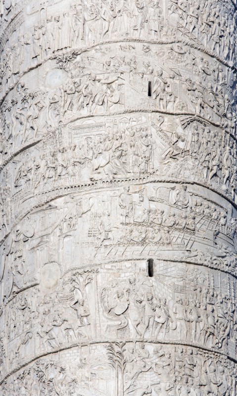ITALY, Lazio, Rome, Detail of Trajan's Column with scenes of his victorious military campaigns carved into the marble