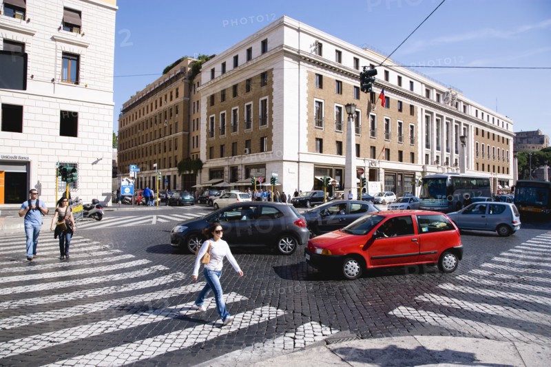ITALY, Lazio, Rome, Pedestrian crossing with people and traffic on the Via della Conciliazione