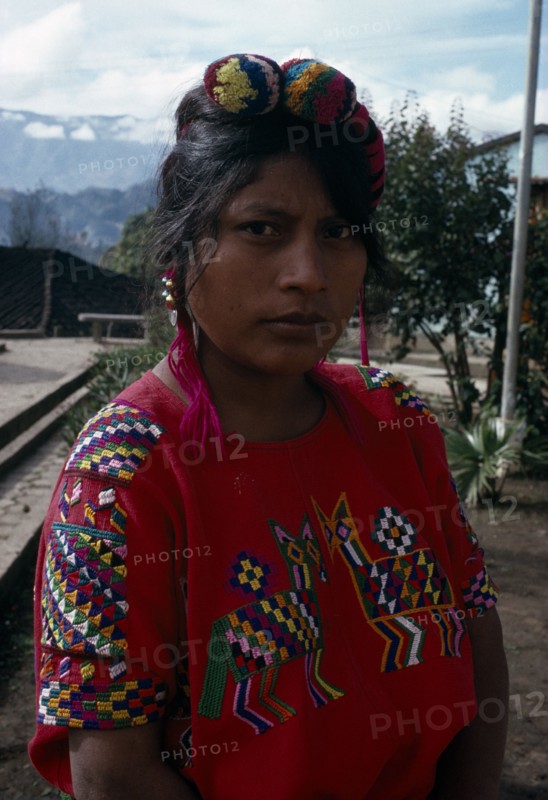 GUATEMALA, El Quiche, Chajul, Portrait of a Ixila Indian girl wearing a red huipile
