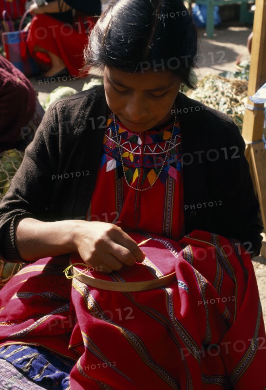 GUATEMALA, Chimaltenango, Patzun, Kakchiquel Indian woman making a huipile blouse