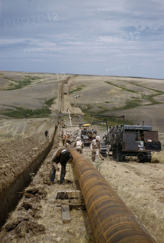 CANADA, Saskatchewan , Prairies, Constructing Trans Canada gas pipeline over Saskatchewan Prairies.