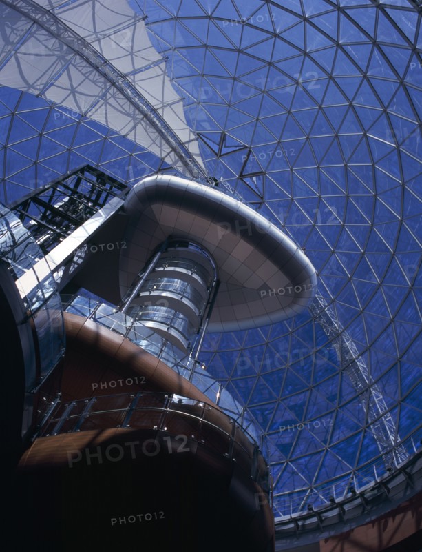 IRELAND, North, Belfast, "Victoria Square shopping centre, interior looking up through glass domed ceiling with curved staircase and balcony."