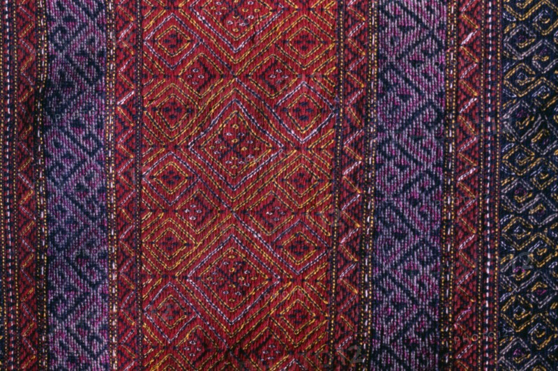 BANGLADESH, Crafts, Textiles, Detail of red and purple woven murang pinon or loin cloth.