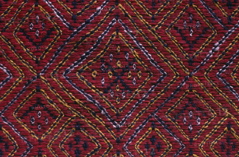 BANGLADESH, Crafts, Textiles, Detail of red and blue embroidered murang pinon or loin cloth.