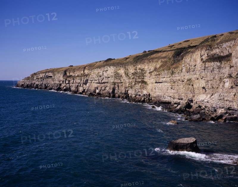 ENGLAND, Dorset, Jurassic Coastline, View west from Seacombe Quarry across the sea towards Winspit Quarry