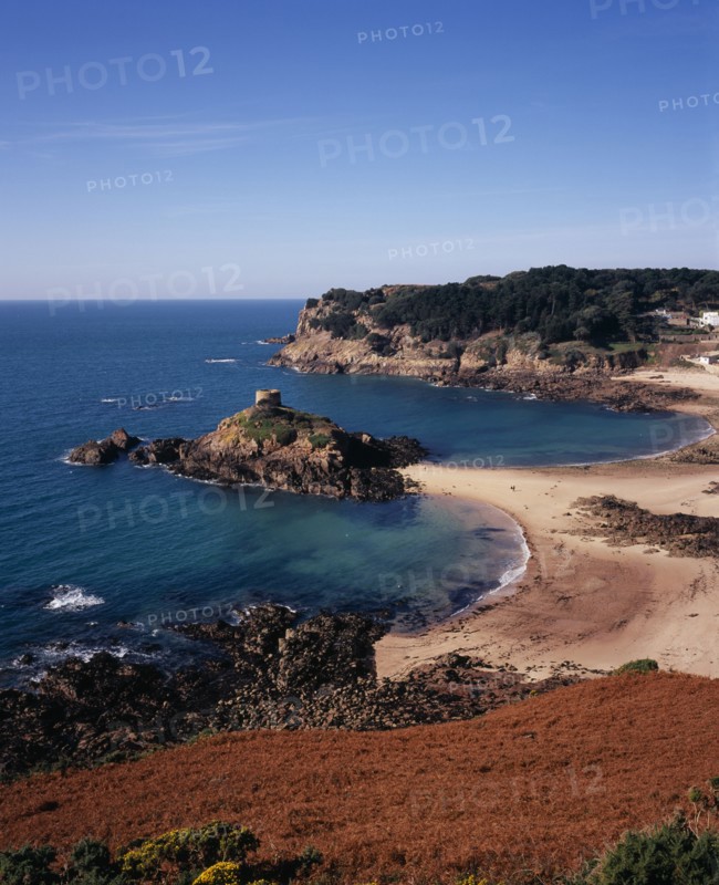 UNITED KINGDOM, Channel Islands, Jersey, St. Brelade. Portelet Bay with Isle au Guerdain a tower built on a tidal island seen in the centre