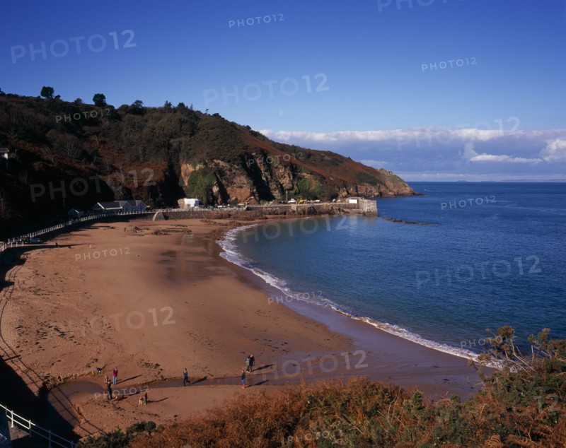 UNITED KINGDOM, Channel Islands, Jersey, St Mary’s. West view across beach at Vill of Greve de Lecq at on the north coast