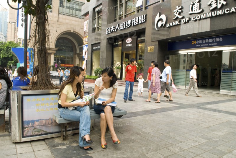CHINA, Sichuan Province, Chongqing, Shoppers chatting in downtown. Chongqing is China's largest city