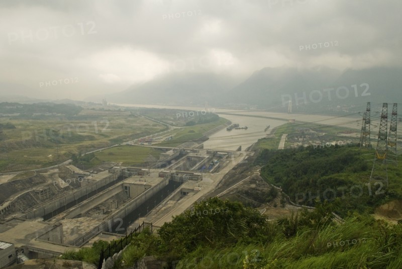 CHINA, Hubei , Sandouping, Hydro-electric pylons and the east bound locks at the Three Gorges Dam project on the Yangtze River at Sandouping. Power generation increased river trade and flood control are the main objectives of the project due for completion in 2009