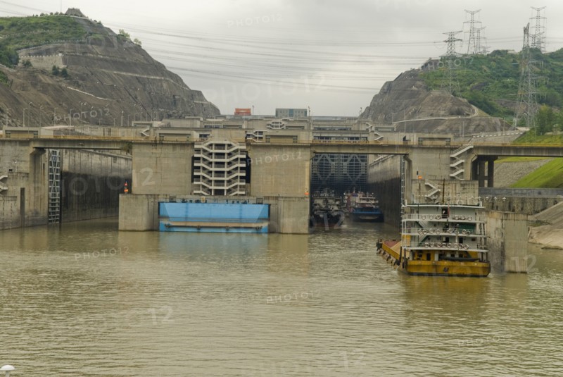 CHINA, Hubei , Sandouping, Sand barge approaching the westbound 5 step locks at the Three Gorges Dam on the Yangtze River at Sandouping