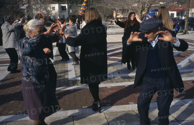 GREECE, Thessalia, Mega Monastiri, Dancing in the village square during New Year carnival.