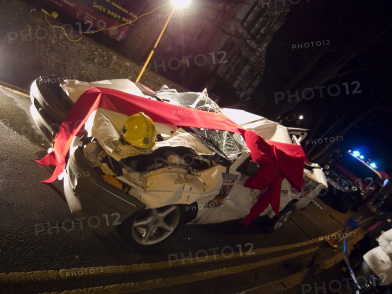 TRANSPORT, Road, Cars, Wrecked car wrapped in red bow as part of a police anti Drink Drive campaign for the Christmas period.