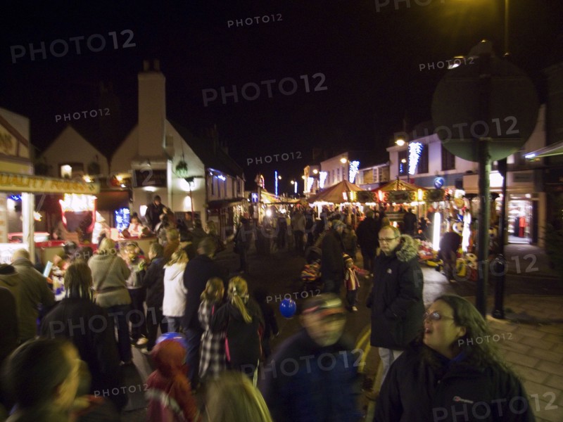 ENGLAND, West Sussex, Shoreham-by-Sea, Christmas shoppers at market in Bridge street.