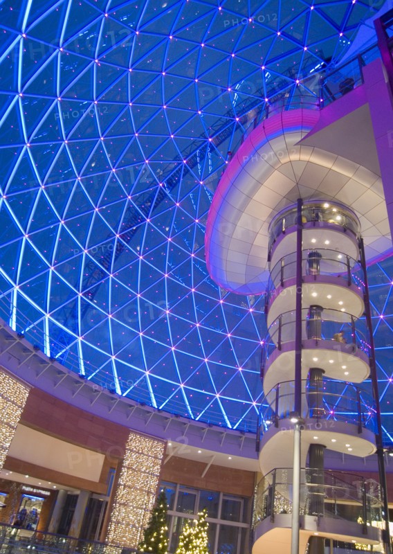 IRELAND, North, Belfast, Victoria Square shopping centre decorated for Christmas. View of the glass dome illuminated at night.