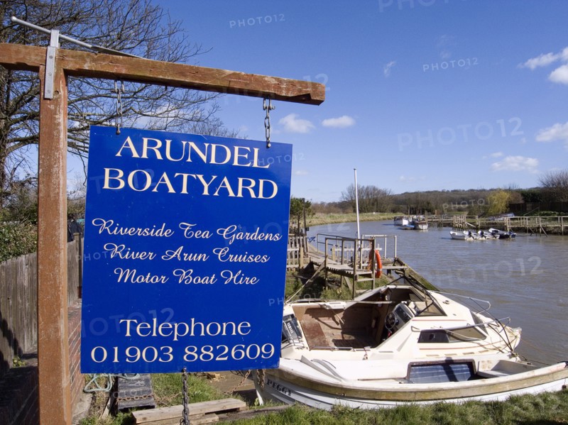 ENGLAND, West Sussex, Arundel, Sign for boatyard on the riverbank.