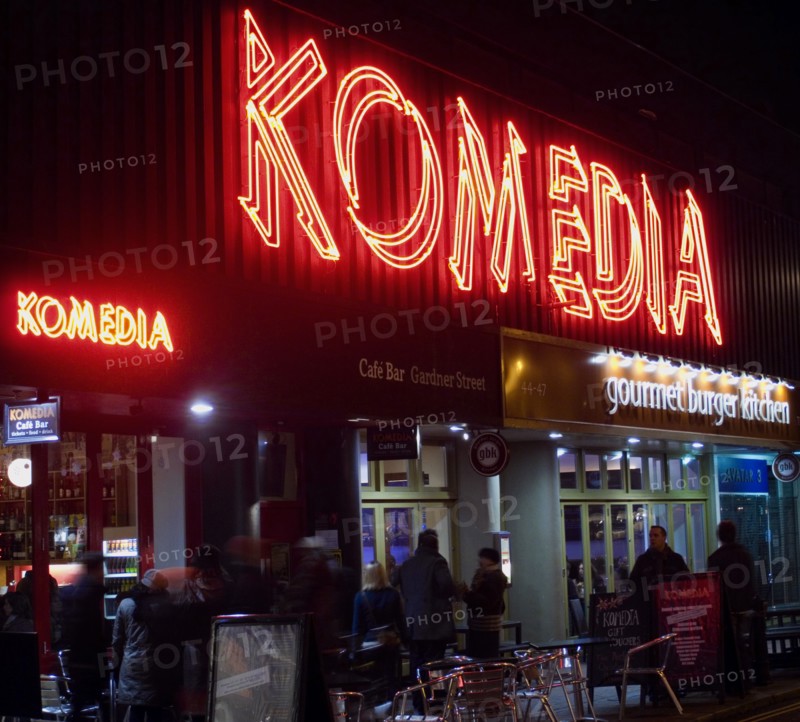 ENGLAND, East Sussex, Brighton, "Exterior of the Komedia theatre, cafe and bar in Gardner Street. Neon Sign"